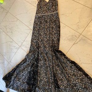 Black lace over white lining, floor-length dress